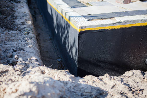 Professional Waterproofing technician working in Plymouth, WI